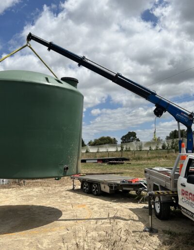 Lifting and Moving a Water Tank with a Mini Crane