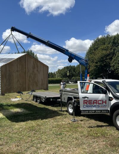 Agricultural And Farming shed being lowered into place by mini hiab crane