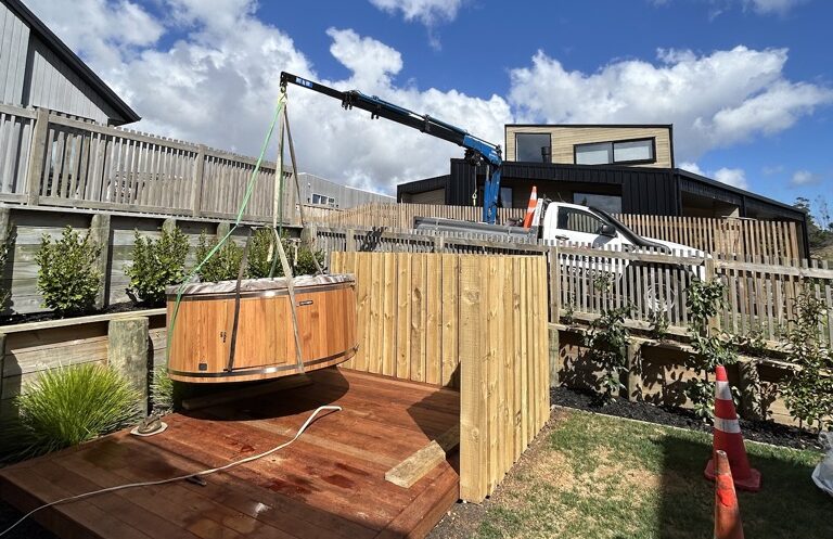 hot tub spa pool being lifted into place by mini crane