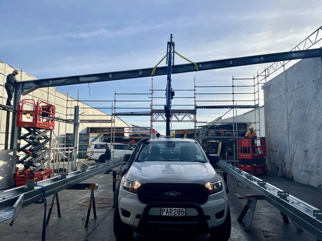 Reach Cranes putting building materials in place